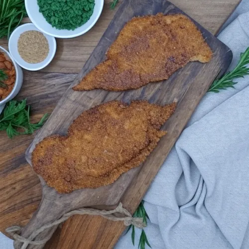 Escalopas de pollo empanada 1/2kg. - Delicies l'Avinguda-Terrassa - 3 Foto